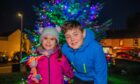 Blair Rodgers, 10, and sister Penny, 4, in front of Auchterarder Christmas tree