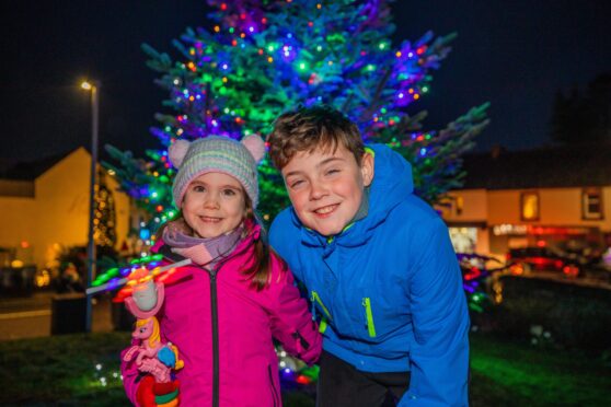Blair Rodgers, 10, and sister Penny, 4, in front of Auchterarder Christmas tree
