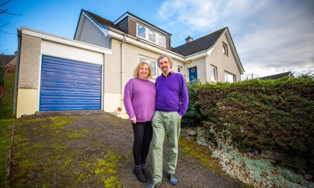 Phil and Andrea Vivian outside their home in Pitlochry.