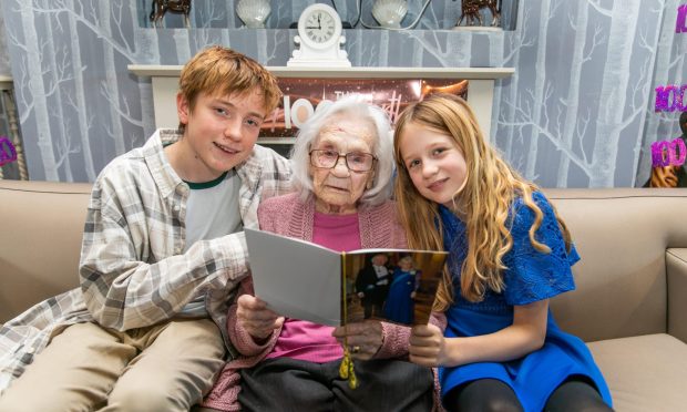 Centenarian Betty with great grandchildren Joe and Izzy Banham-Hall. Image: Steve Brown/DC Thomson