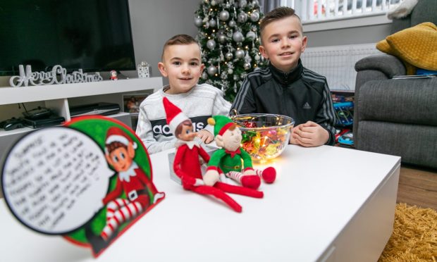 Brothers Tommi and Lochlan Campbell with their Christmas elves
