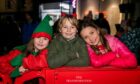 Lilly May, Kenzie Spence Smith and Ella Smart at Christmas lights switch on in Cupar's Bonnygate. Image: Steve Brown/DC Thomson