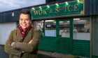 TV presenter Nick Kwek outside the takeaway his parents ran when he was growing up in Fife.