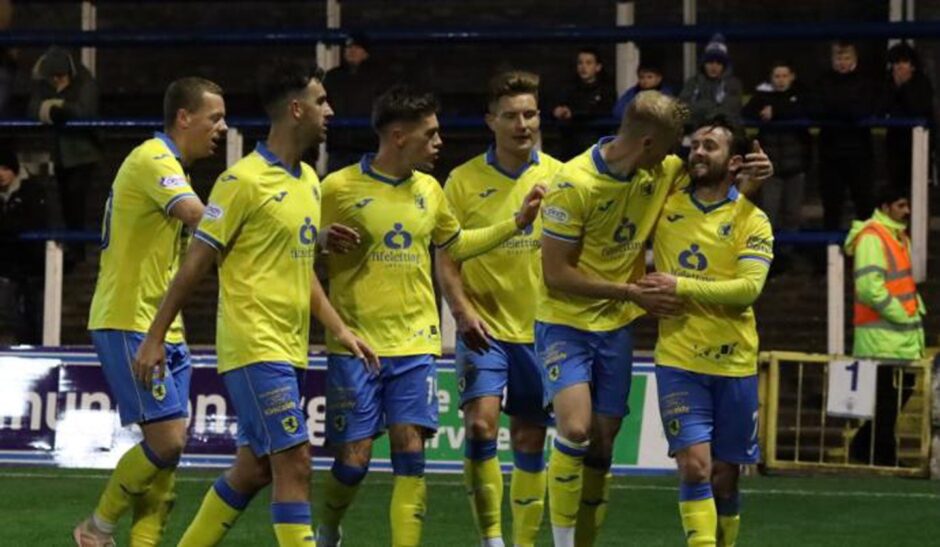 Aidan Connolly celebrates with his Raith Rovers teammates. 