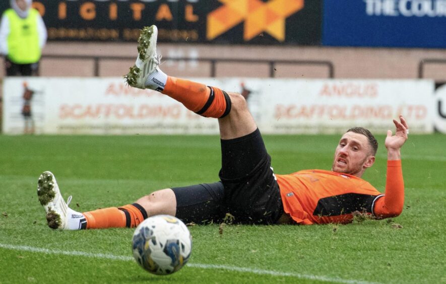 A frustrated Dundee United striker Louis Moult sees his shot drift off target against Inverness.