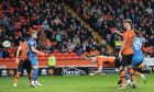 Kevin Holt's diving header sealed a draw for Dundee United against Inverness