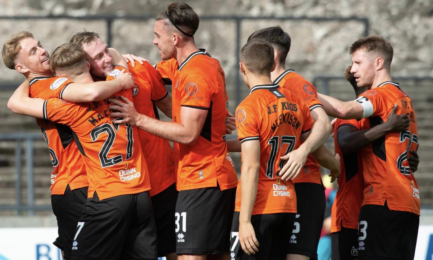 Dundee United players celebrate Kevin Holt's goal against Ayr United