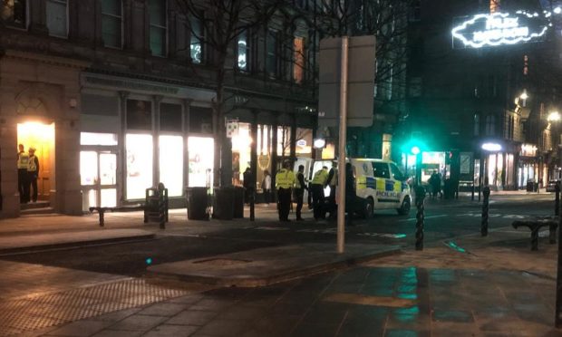 Officers swooped on Commercial Street on Thursday evening. Image: James Simpson/DC Thomson