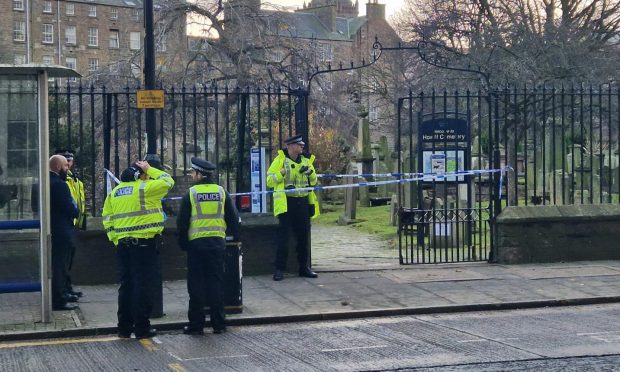 Police outside The Howff graveyard on Monday morning. Image: Andrew Robson/DC Thomson