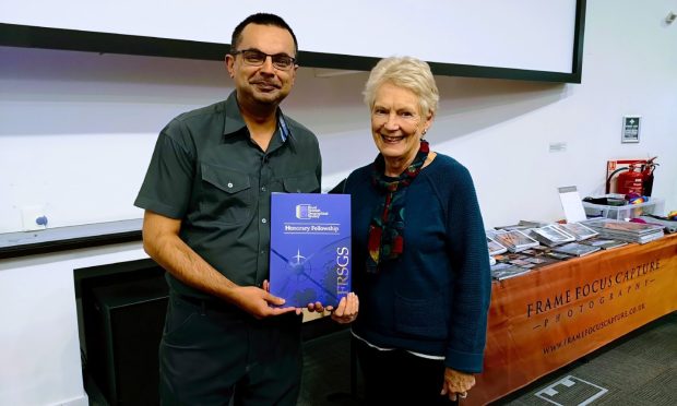 Shahbaz Majeed receives his honorary fellowship of the RSGS from Lorna Ogilvie. Image: RSGS