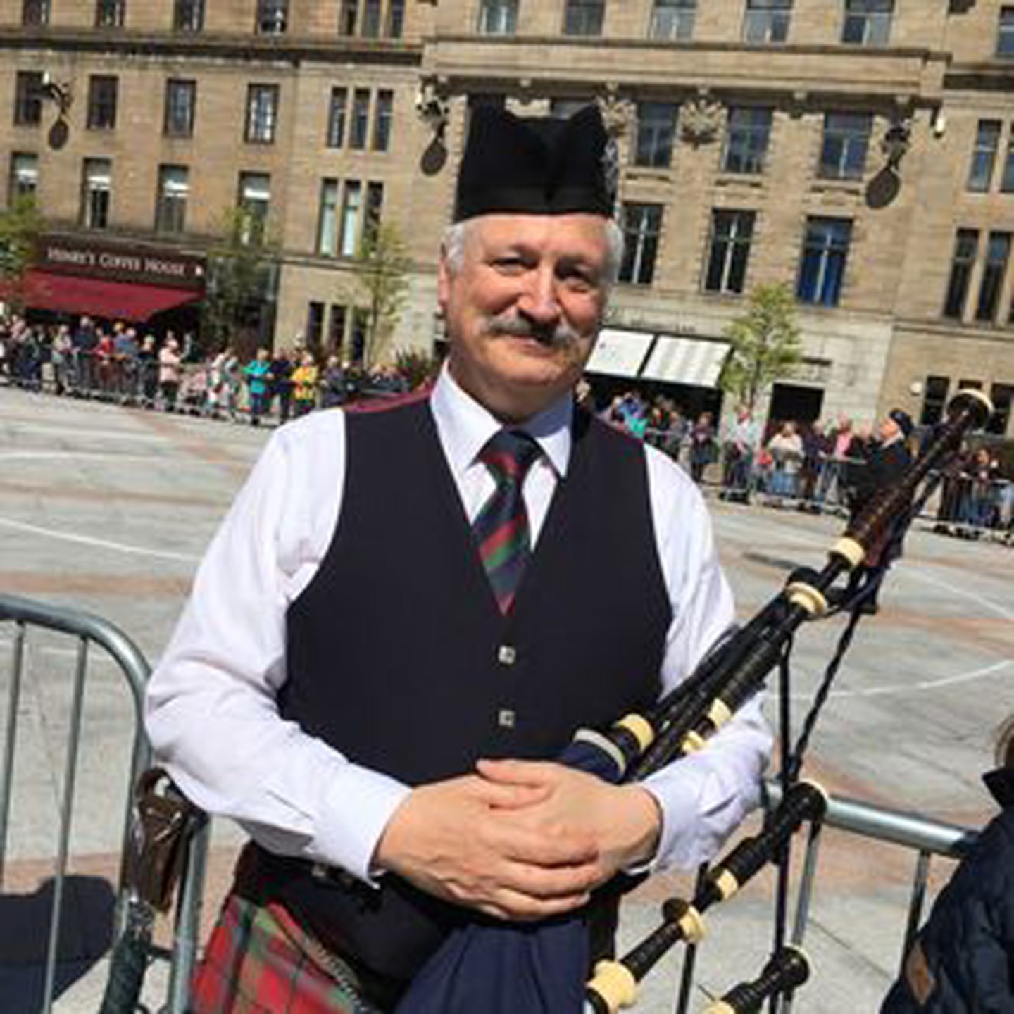 Tom with his bagpipes in Dundee.