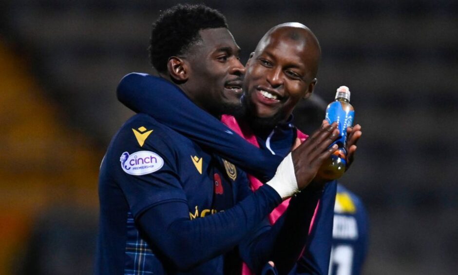 Amadou Bakayoko (left) celebrates with Mo Sylla at full-time of Dundee's 4-0 demolition of St MIrren. Image: SNS