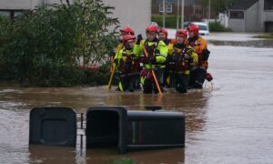 Rescuers in Brechin's River Street during Storm Babet Image: PA