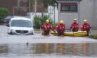 A boat rescue in action in Brechin during Storm Babet.