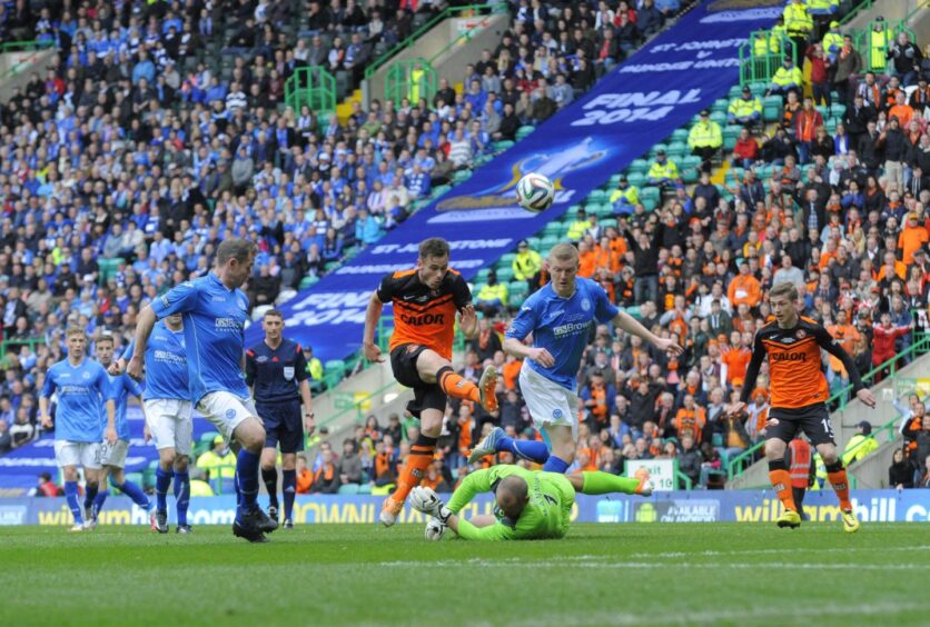 Alan Mannus kept a clean sheet in the 2014 Scottish Cup final. On the rare occasion the Dundee United players got behind the Saints back four, he was there to do his bit - as on this occasion, denying Keith Watson.
