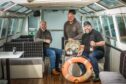 Angus Alchemy co-owners Phil Paton, Martin Brown and Campbell Archibald inside the boat which will became a restaurant. Image: Mhairi Edwards/DC Thomson