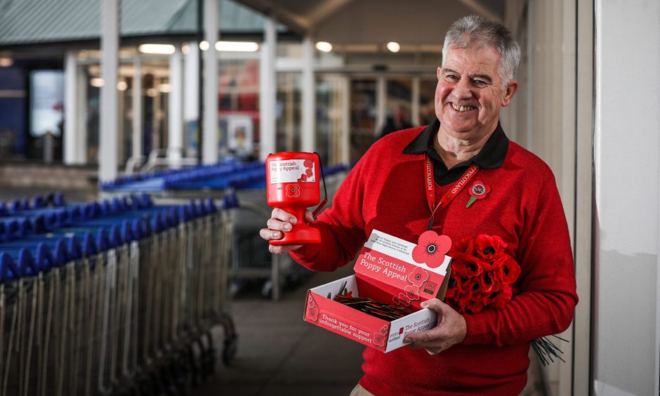 Volunteer Colin Maccoll with poppies outside Riverside Tescos in Dundee. 