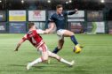 Daniel O'Reilly challenges Raith's Jamie Gullan in a Championship fixture last season. Image: SNS.