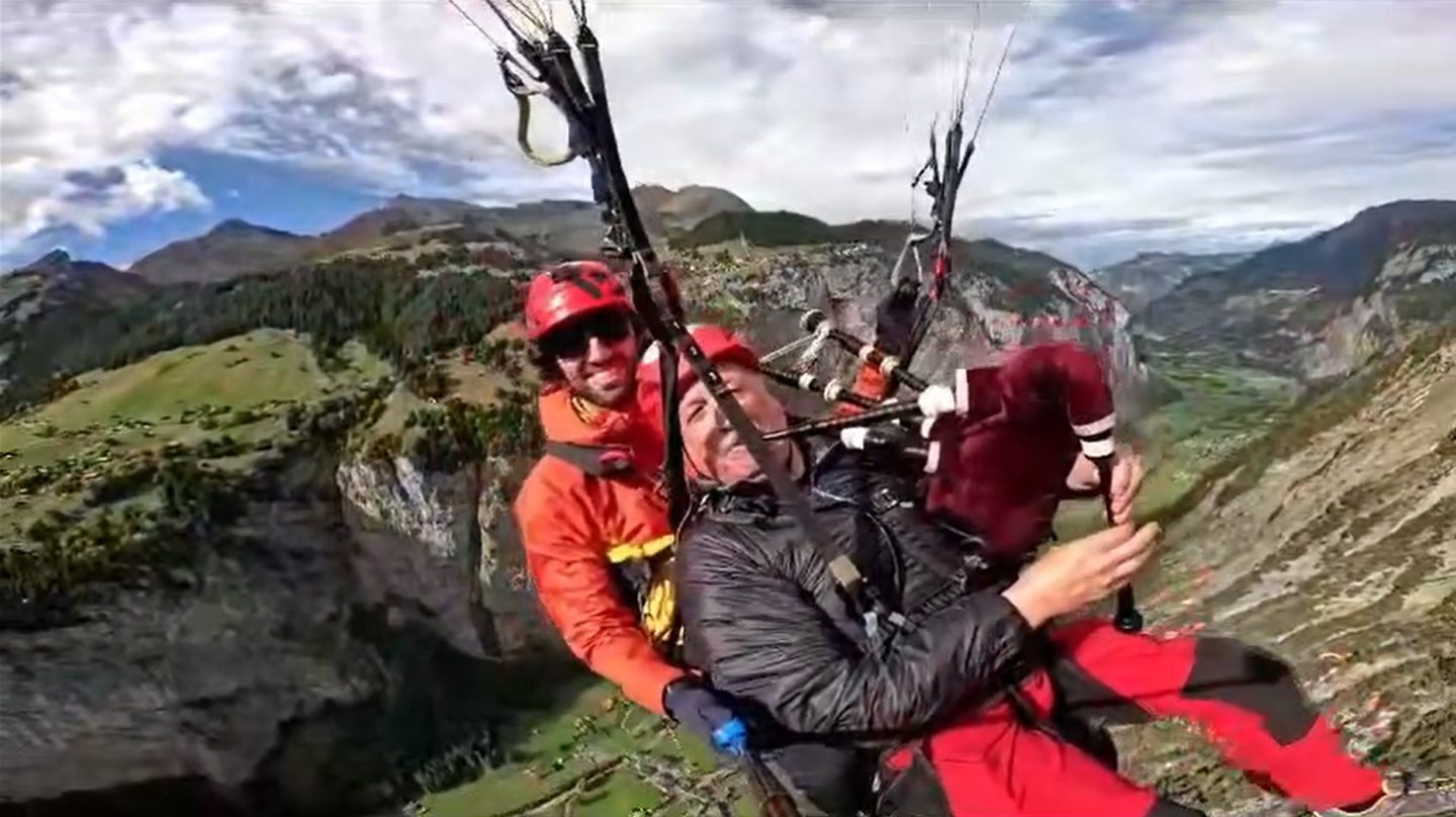 Tom paragliding with his bagpipes.