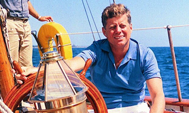 John F Kennedy enjoying his passion for sailing before his death. Image: PA.