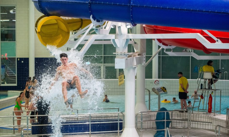A swimmer comes out of the flumes at Dundee Olympia