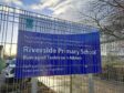 Sign for Riverside Primary with wrong spelling of Argyll Road.