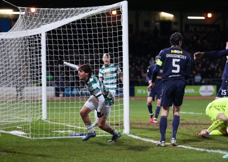 Paulo Bernardo squeezes in Celtic's opener at Dundee. Image: Shutterstock