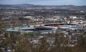 An image of Dundee and Dundee United's stadiums is on the front cover of Staantribune. Image: SNS.