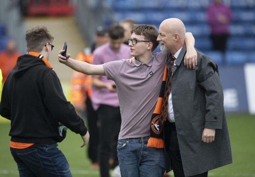 Dundee United owner Mark Ogren poses for a selfie following a win against Ross County.