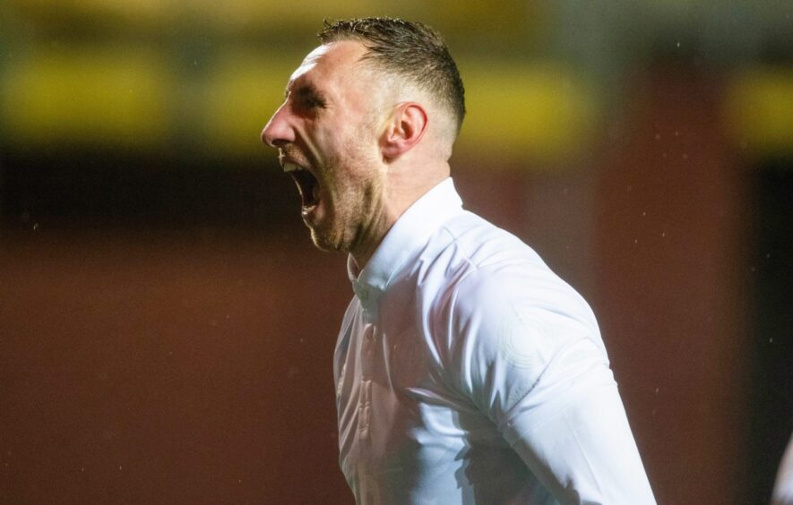 Dundee United attacker Louis Moult celebrates finding the net against Arbroath on October 27