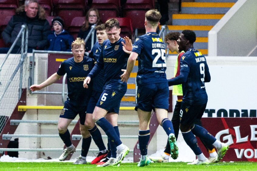 Dundee celebrate taking the lead at Motherwell. Image: SNS