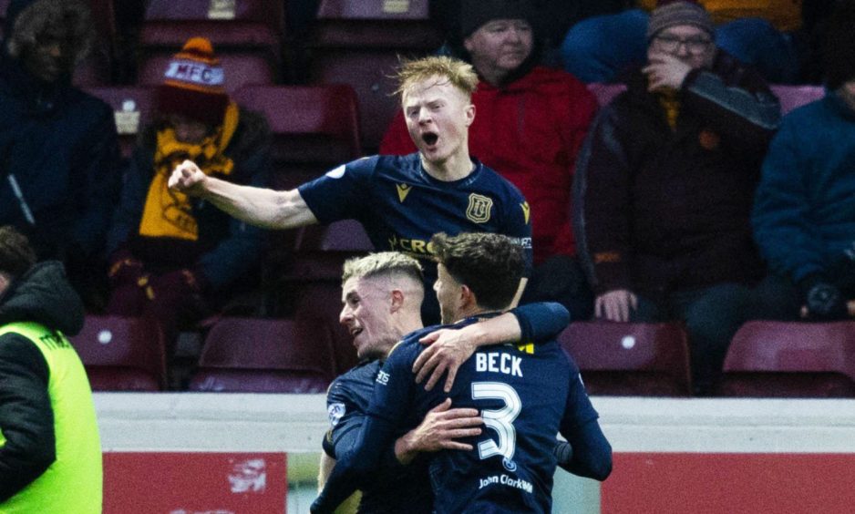Lyall Cameron, Luke McCowan and Owen Beck celebrate as Dundee go in front at Motherwell. Image: SNS