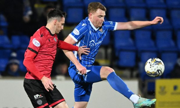 St Johnstone's James Brown and St Mirren's Scott Tanser in action.