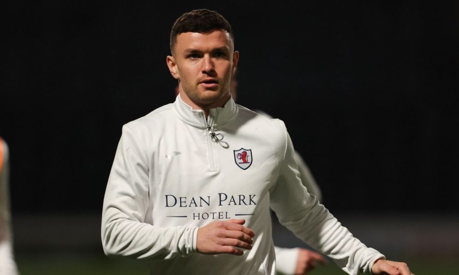 Raith Rovers midfielder Ross Matthews goes through a warm-up.