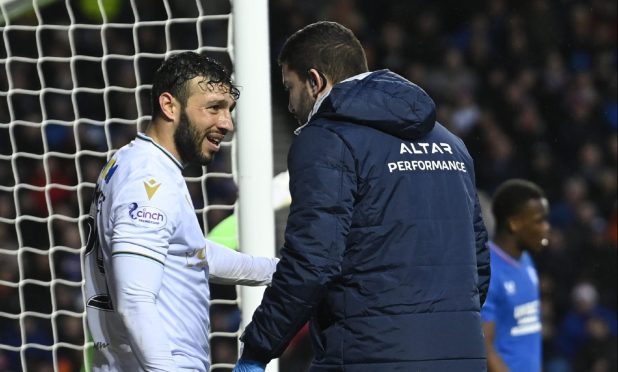 Antonio Portales gets treatment at Ibrox but could be missing for Dundee FC in the games to come. Image: SNS