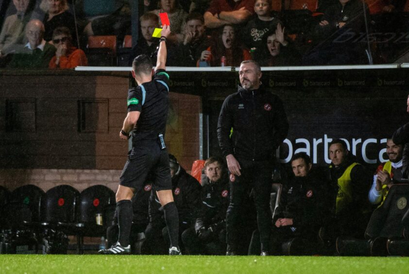 Dave Bowman, famously combative as a player, receives a red card as a coach