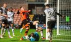 Kai Fotheringham scrambles the ball over the line for Dundee United against Ayr United