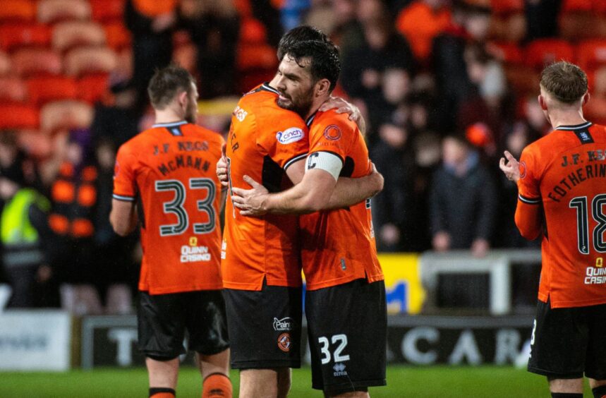 Tony Watt, right, and Declan Gallagher embrace after seeing out a vita win