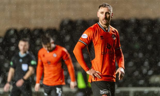 Louis Moult cuts a dejected figure for Dundee United