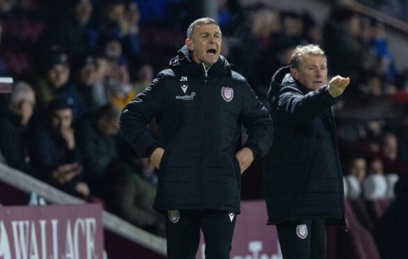 Arbroath manager Jim McIntyre shouts instructions from the sidelines.