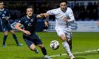 Dundee defender Ricki Lamie in control against Ross County. Image: SNS