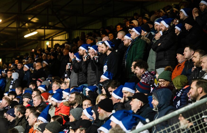 Raith Rovers fans get in the festive spirit with blue Santa hats against Dundee United in December.