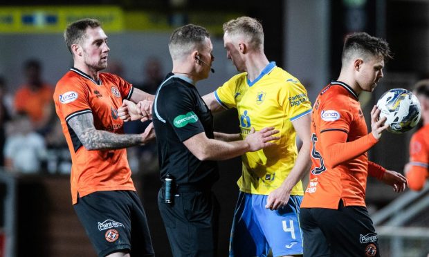 Kevin Holt of Dundee United argues with Dundee United's Ross Millen