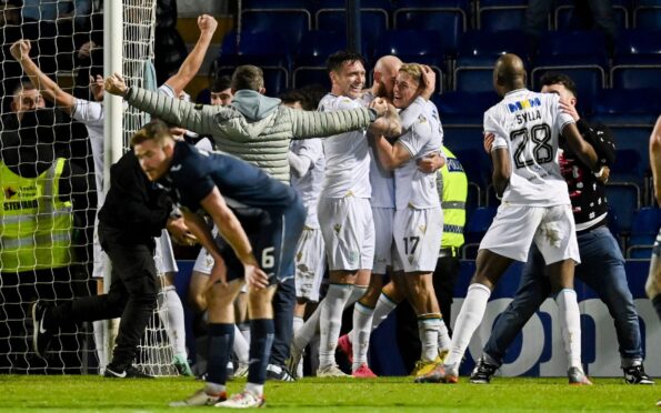 Dundee celebrate their last-gasp winner. Image: SNS