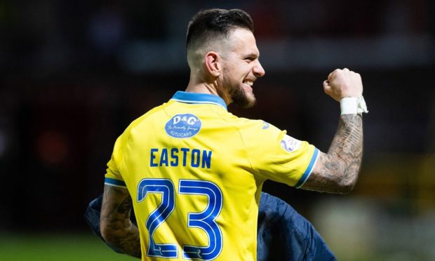 Raith Rovers attacker Dylan Easton clenches his fist in celebration.