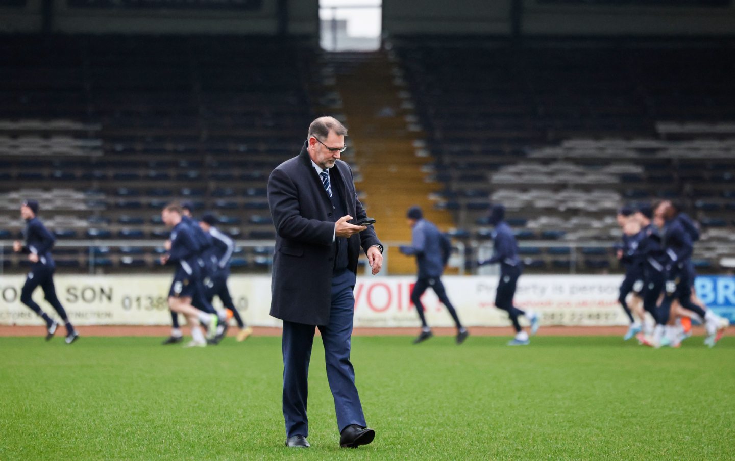 Dundee managing director John Nelms on the Dens Park pitch. Image: SNS