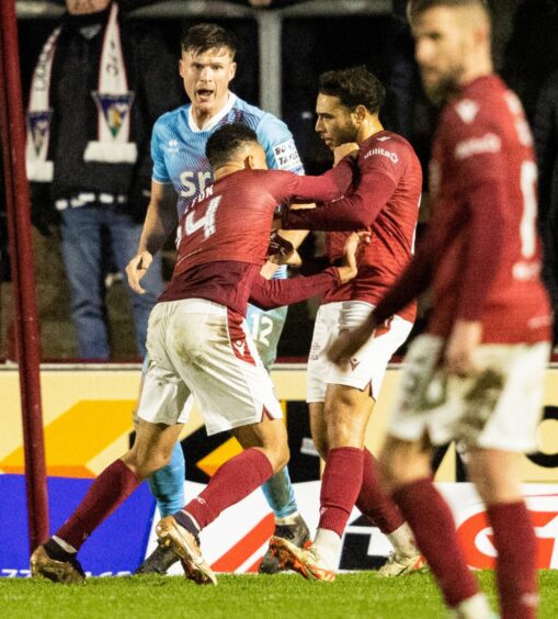 Arbroath forward Jermaine Hylton appears to throw a punch at team-mate Jay Bird during the 1-1 draw with Dunfermline Athletic. Image: Mark Scates / SNS Group.