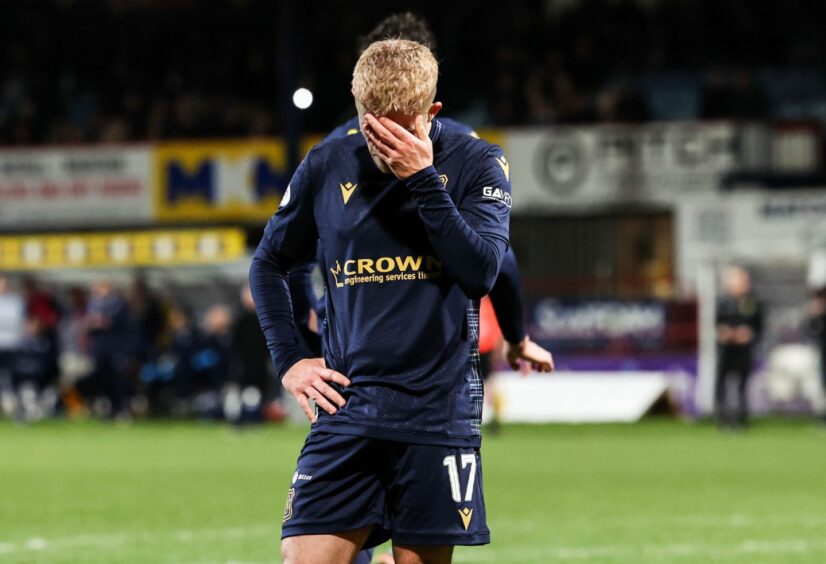 Dundee's Luke McCowan is dismayed as his side fall to defeat against Celtic. Image: SNS