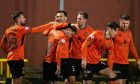 Delirious Dundee United players celebrate against Partick Thistle