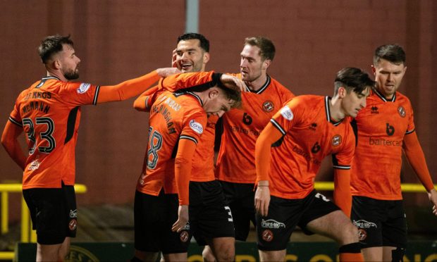 Delirious Dundee United players celebrate against Partick Thistle